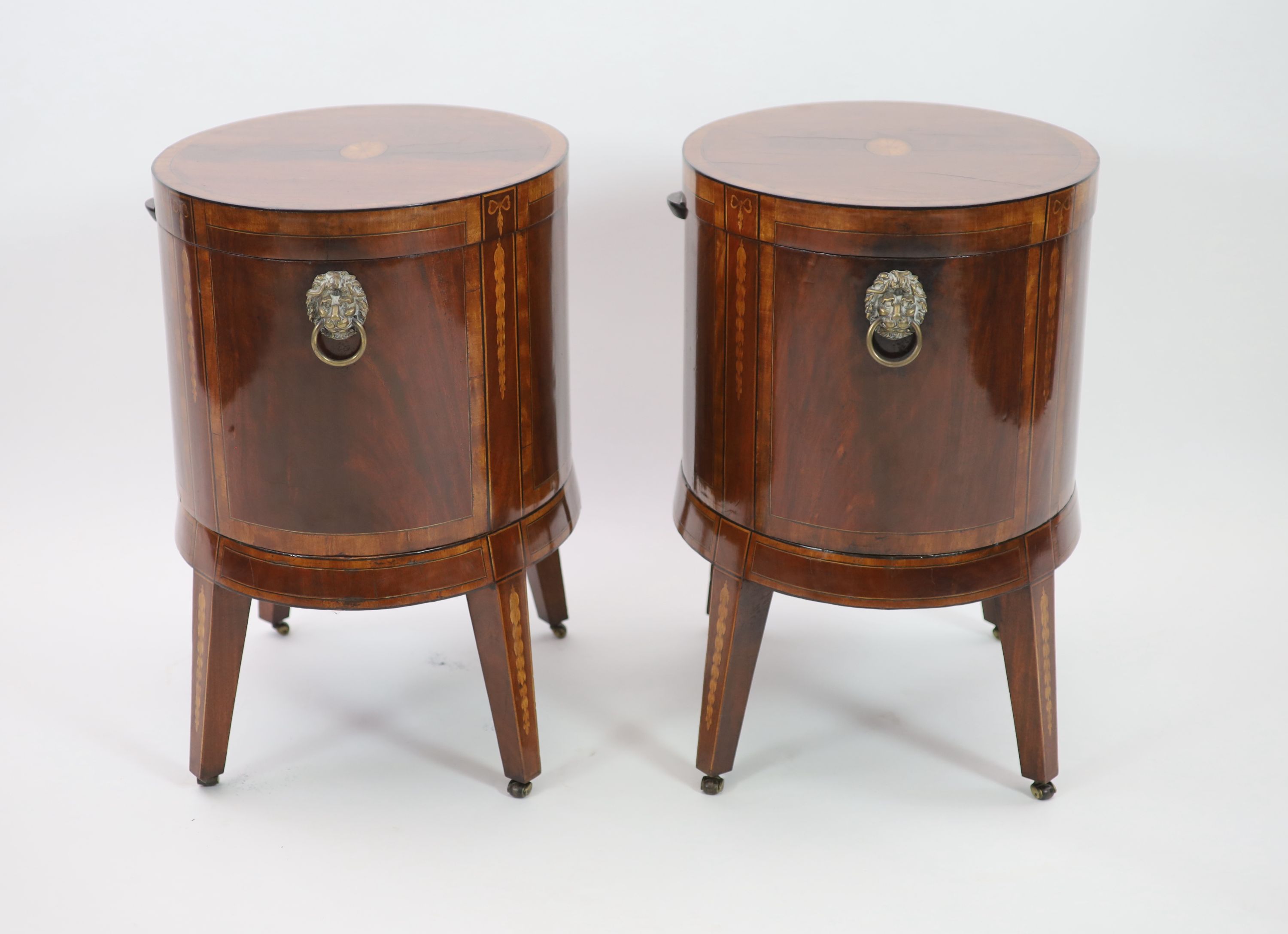 A pair of George III Sheraton style oval inlaid mahogany cellarets, W.64cm D.46cm H.68cm